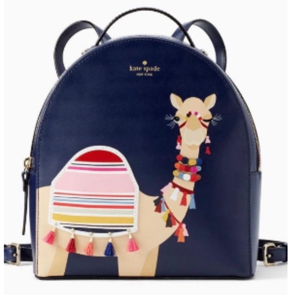 Limited edition Kate Spade camel backpack with tassels.